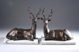 Sihattakitkosol Somchai, THE STAGS: TWO WORKS, each signed, numbered 112/1000 and 168/1000, Bronze, golden brown patina, on grey marble bases - Height: 11 in