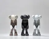 Kaws, SMALL LIE (BROWN); SMALL LIE (BLACK); and SMALL LIE (GREY), 2017, Three painted vinyl multiples, all contained in the original Medicom packaging