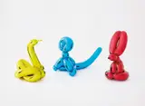Jeff Koons, Balloon Swan (Yellow); Balloon Monkey (Blue); and Balloon Rabbit (Red), 2017, Three porcelain multiples painted in chrome, all contained in the original foam lined boxes with silver printed signature