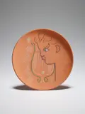 Orphée à la lyre (Orpheus at the Lyre) by Jean Cocteau, 1958, Red earthenware round dish painted in coloured enamels with crayon d'oxyde additions, sold Sep 2020