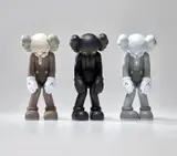 Kaws, SMALL LIE (BROWN); SMALL LIE (BLACK); and SMALL LIE (GREY), 2017, Three painted vinyl multiples, all contained in the original Medicom packaging