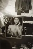 Diane Arbus, Tattooed female impersonator applying make-up in a mirror, N.Y.C.