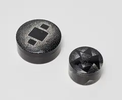 Two lidded boxes by Jean Dunand, circa 1925, Lacquered nickel-plated brass, eggshell inlay, sold Jun 2020