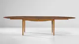 Extendable dining table, model no. FJ 49 by Finn Juhl, designed 1948, Brazilian rosewood-veneered wood, Brazilian rosewood, precious metal, sold Jun 2020