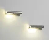 Arne Jacobsen, Pair of wall lights, model no. 34505, 1965-1971, Stainless steel