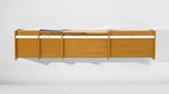 Illuminated wall-mounted cabinet by Gio Ponti, circa 1965, Ash-veneered wood, ash, plastic-laminated wood, brass, glass, sold Jun 2020