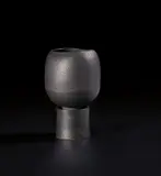 Hans Coper, Pot on cylindrical foot, circa 1974, Stoneware, black glaze, the interior with a cylindrical stem-holder