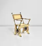 Carlo Bugatti, Armchair, circa 1902, Partially painted vellum-covered wood, embossed vellum, oak, repoussé brass