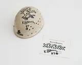 Keith Haring, Untitled (Helmet and Invitation), 1987, marker pen on helmet and printed paper