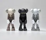 Kaws, Three works: (i) SMALL LIE (Brown); (ii) SMALL LIE (Black); (iii) SMALL LIE (Grey), 2017, painted vinyl, in original Medicom packaging