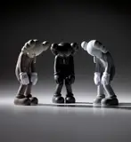 Kaws, Three works: (i) Small Lie (Brown); (ii) Small Lie (Black); (iii) Small Lie (Grey), 2017, painted vinyl, in original Medicom packaging