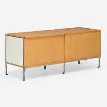 ESU 100-C by Charles and Ray Eames, ash, lacquered Masonite, zinc-plated steel, molded birch plywood, sold Feb 2025