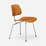 DCM by Charles and Ray Eames, aniline-dyed birch plywood, chrome-plated steel, rubber, sold Feb 2025