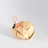 Felix Droese, Atlas, 1990, Ausstellungsplakat, gerissen und zerknüllt, mit Garn umwickelt. Ø ca. 12cm