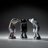 Kaws, Three works: (i) Small Lie (Brown); (ii) Small Lie (Black); (iii) Small Lie (Grey), 2017, painted vinyl, in original Medicom packaging