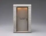 Maurizio Cattelan, The 1:6 Scale Wrong Gallery, 2006, Multiple comprising wood, brass, steel, aluminum, resin, plastic, glass and electric lighting, with accompanying copy of the Wrong Gallery Times, all contained in the original cardboard box