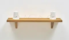 Set in Stone by Mona Hatoum, 2002, Two Carrara marble forms with carved typography ( East and West in Arabic) and string on an oak shelf, sold Jun 2019
