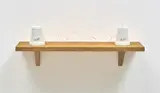 Mona Hatoum, Set in Stone, 2002, Two Carrara marble forms with carved typography ( East and West in Arabic) and string on an oak shelf