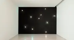 Joseph Kosuth, Sigla, Finnegans Wake, from Wall Works, 1998, Ten letter-shaped warm white fluorescent lights, to be installed on a matte-satin black painted wall