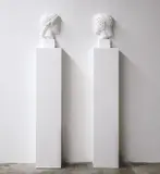 Giulio Paolini, Vis-à-vis (Hera), from Wall Works, 1992, Two halves of a plaster bust on two white painted wooden pedestals, to be installed facing each other, spaced 35 cm apart
