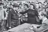 Gestapo informer recognised by a woman she had denounced, Transit Camp, Dessau, Germany by Henri Cartier-Bresson, 1945, Gelatin silver print, printed later, sold May 2019