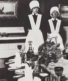 Parlourmaid and under-parlourmaid ready to serve dinner by Bill Brandt, 1936, Gelatin silver print, printed 1979-1980, mounted, sold May 2019