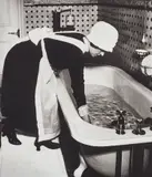 Parlourmaid preparing a bath before dinner, London by Bill Brandt, 1939, Gelatin silver print, printed 1979-1980, mounted, sold May 2019