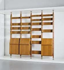 Unique bookcase, designed for the study of Casa F., Milan by Franco Albini, circa 1956, Walnut-veneered wood, walnut, brass, sold Mar 2019
