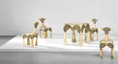 Carlo Bugatti, Rare games table and set of four chairs, circa 1902, Vellum-covered wood, repoussé brass, brass, pewter, ebonised veneered-wood, walnut-veneered wood