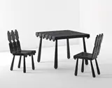 Jean Royere, 'Quille' table and pair of chairs, circa 1955, Painted wood
