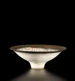 Footed bowl by Lucie Rie, circa 1980, Stoneware, matt white glaze with golden manganese lip, sold Oct 2019