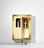 Illuminated 'Positivo-negativo' wall-mounted cabinet with tower and queen statuettes by Gio Ponti, circa 1951, East Indian rosewood-veneered wood, painted wood, brass, glazed earthenware, sold Mar 2019