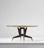 Gio Ponti, Dining table, circa 1951, East Indian rosewood-veneered wood, stained walnut, painted wood, glass, brass