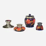 Moorcroft Pottery, Collection of Pomegranate tabletop accessories with applied mounts
