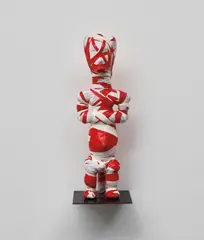 Kendell Geers, Twilight of the Idols (115), 2005, found object wrapped in chevron tape on artist's metal base