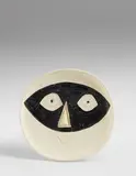 Tête au masque (Head with Mask) by Pablo Picasso, 1956, White earthenware round dish, painted in white enamel with black and ivory brushed glaze, sold Jan 2018