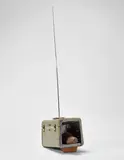 Edward Kienholz and Nancy Kienholz, The Same Old Shoe, 1984, Unique television multiple, comprising a 1950s vanity case, wooden shoe last, light bulbs, lead sheeting, plastic knobs, antennae, and hand-applied polyester resin