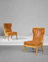 André Arbus, Pair of chairs, designed for the 'Jean Laborde' ocean liner, circa 1953, Sycamore, leather