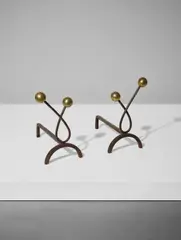 Pair of 'Boules' andirons by Jean Royere, circa 1950, Patinated steel, brass, sold Apr 2018