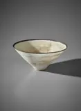 Conical bowl by Lucie Rie, circa 1980, Stoneware, mixed glazes and a dark manganese rim, sold Apr 2018