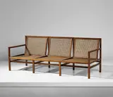 Three-seater sofa by Joaquim Tenreiro, circa 1958, Brazilian rosewood, cane, sold Apr 2018