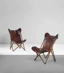 Viganò, Pair of 'Tripoline' folding chairs, circa 1936, Walnut, leather, brass, steel