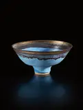 Footed bowl by Lucie Rie, 1985, stoneware, matt blue glaze with golden manganese lip, sold Oct 2018