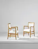 Gio Ponti, Pair of armchairs, designed for the first class dining room of the 'Africa' ocean liner, circa 1953, Oak, fabric, brass