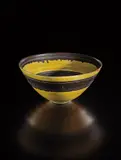 Bowl by Lucie Rie, circa 1964, Porcelain, manganese and yellow glaze with sgraffito, sold Oct 2018