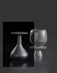 Bottle with hourglass base and disc lip by Hans Coper, circa 1965, Stoneware, black glaze, offered Oct 2018