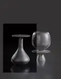 Bottle with hourglass base and disc lip by Hans Coper, circa 1965, Stoneware, black glaze, offered Oct 2018