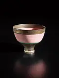 Footed bowl by Lucie Rie, circa 1975, Porcelain, inlaid pink lines, turquoise and manganese bands, sold Oct 2018