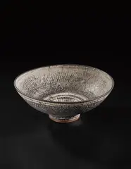 Monumental 'knitted' bowl by Lucie Rie, circa 1976, Stoneware, inlaid with manganese beneath grey, sold Oct 2018