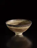 Monumental footed bowl by Lucie Rie, 1961, Porcelain, inlaid sgraffito grid beneath a cream glaze, manganese band around lip, offered Oct 2018